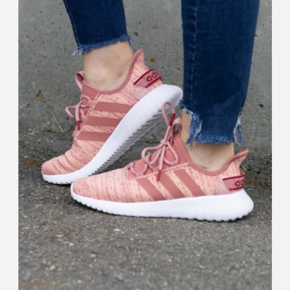 This is a pair of Adidas Kaptir Flow shoes in a coral and beige colorway.